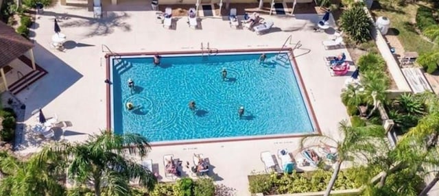 2115 N Halcyon Dr Unit 510, Sun City Center, FL 33573 - community pool featuring a patio