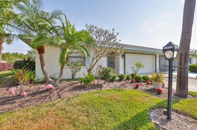 2115 N Halcyon Dr Unit 510, Sun City Center, FL 33573 - view of side of property with a garage and stucco siding