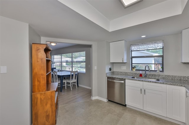 2115 N Halcyon Dr Unit 510, Sun City Center, FL 33573 - kitchen with dishwasher, a sink, light stone counters, baseboards, and healthy amount of natural light