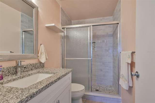 2115 N Halcyon Dr Unit 510, Sun City Center, FL 33573 - bathroom featuring a stall shower, toilet, and vanity