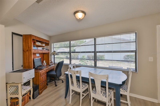 2115 N Halcyon Dr Unit 510, Sun City Center, FL 33573 - home office with a textured ceiling, light wood-style flooring, and baseboards