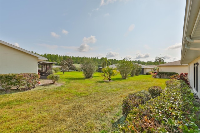 2115 N Halcyon Dr Unit 510, Sun City Center, FL 33573 - view of green lawn with a sunroom