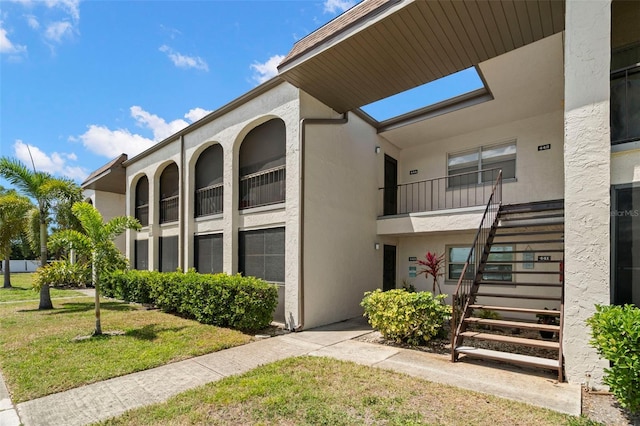 7701 Starkey Rd Unit 443, Seminole, FL 33777 - view of building exterior featuring stairway