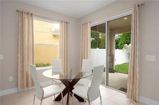 4407 Scarlet Loop, Wesley Chapel, FL 33544 - dining space with baseboards and light tile patterned flooring