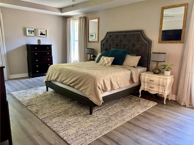 4407 Scarlet Loop, Wesley Chapel, FL 33544 - bedroom with baseboards and wood finished floors