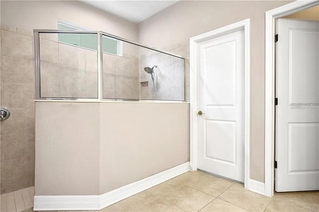4407 Scarlet Loop, Wesley Chapel, FL 33544 - bathroom featuring a walk in shower, tile patterned floors, and baseboards