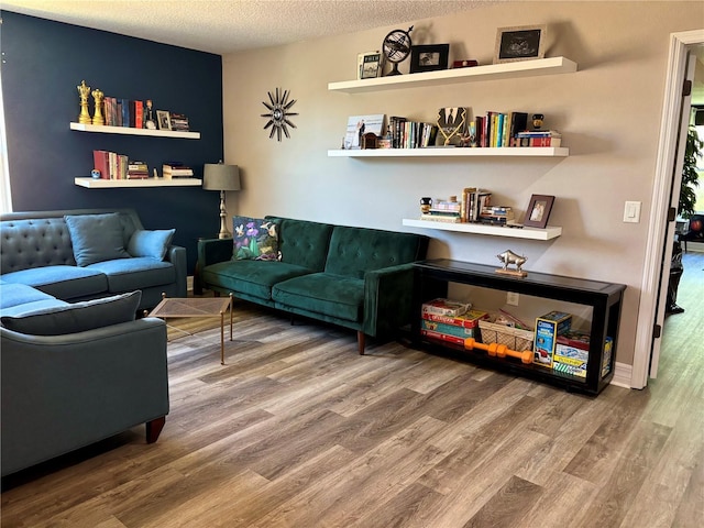4407 Scarlet Loop, Wesley Chapel, FL 33544 - living area with wood finished floors and a textured ceiling