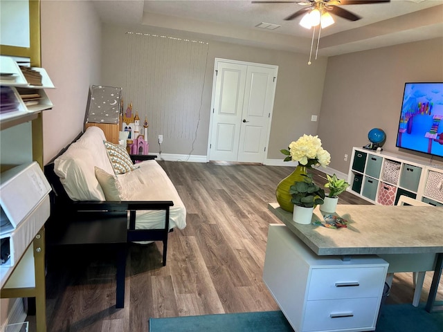 4407 Scarlet Loop, Wesley Chapel, FL 33544 - living room featuring wood finished floors, a ceiling fan, and baseboards