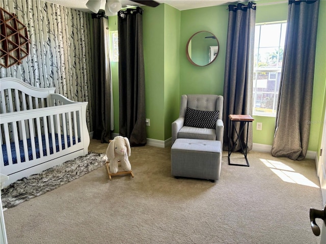 4407 Scarlet Loop, Wesley Chapel, FL 33544 - bedroom with a crib, carpet flooring, and baseboards
