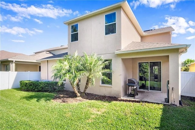 4407 Scarlet Loop, Wesley Chapel, FL 33544 - rear view of property featuring stucco siding, a patio, and a shingled roof