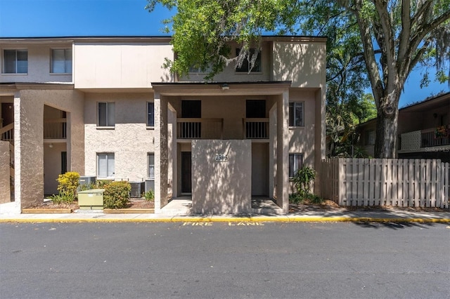 7505 Pitch Pine Cir Unit 122, Tampa, FL 33617 - view of property with fence and central AC