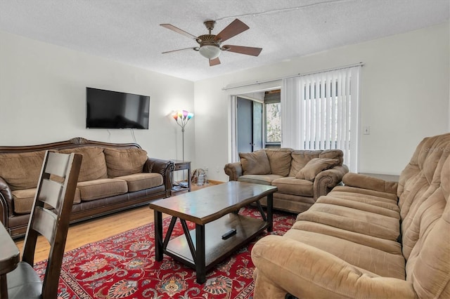 7505 Pitch Pine Cir Unit 122, Tampa, FL 33617 - living area featuring ceiling fan, a textured ceiling, and wood finished floors