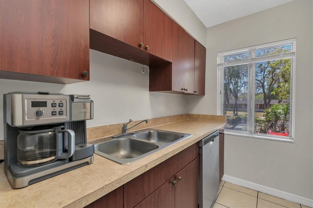 7505 Pitch Pine Cir Unit 122, Tampa, FL 33617 - kitchen featuring light countertops, a sink, a wealth of natural light, baseboards, and dishwasher