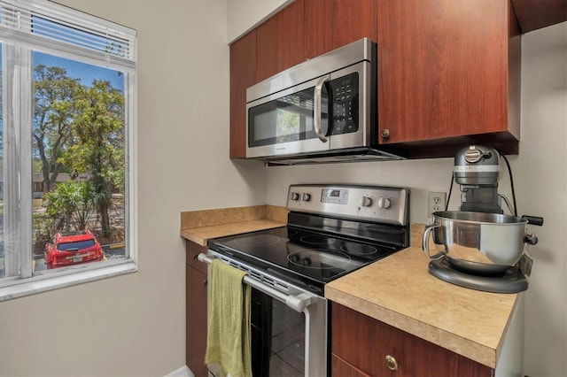 7505 Pitch Pine Cir Unit 122, Tampa, FL 33617 - kitchen with stainless steel appliances and light countertops