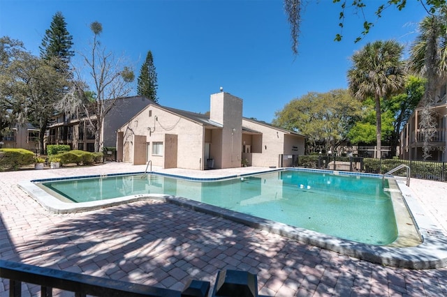7505 Pitch Pine Cir Unit 122, Tampa, FL 33617 - community pool featuring fence and a patio