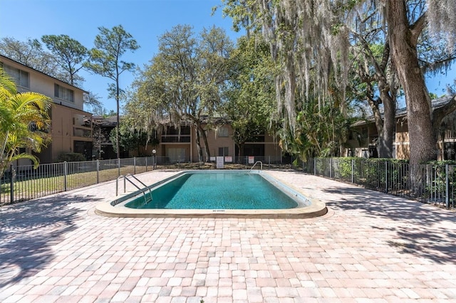 7505 Pitch Pine Cir Unit 122, Tampa, FL 33617 - community pool featuring a patio and fence