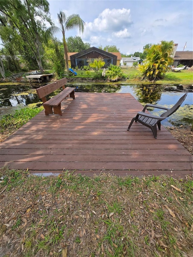 wooden deck featuring a water view
