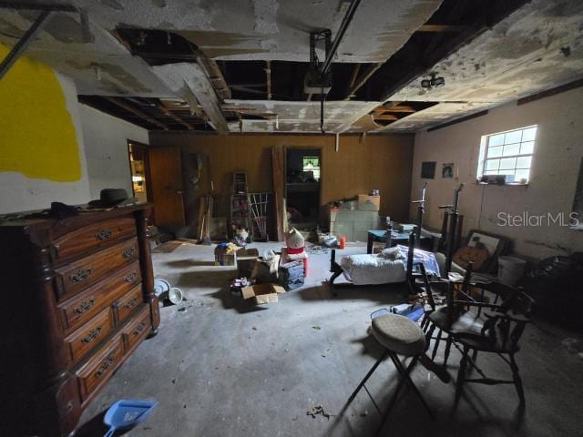 miscellaneous room with concrete flooring and a garage