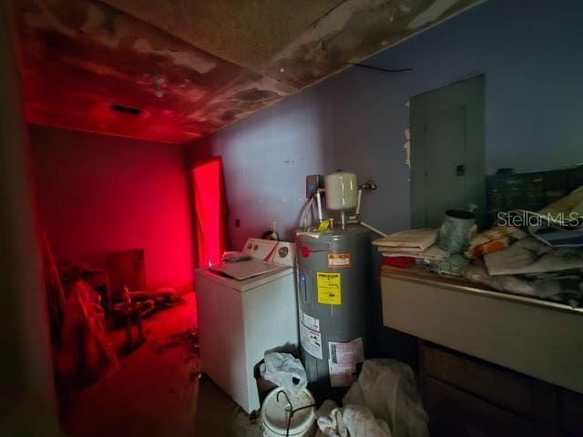 utility room with washer / dryer, water heater, and electric panel