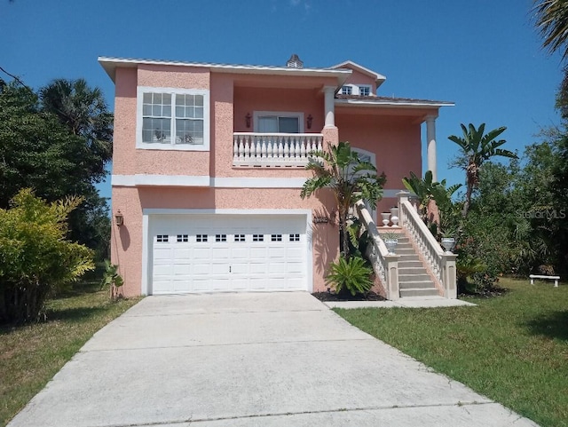 6926 Mccray Dr, Hudson, FL 34667 - view of front facade featuring stairs, stucco siding, an attached garage, and concrete driveway