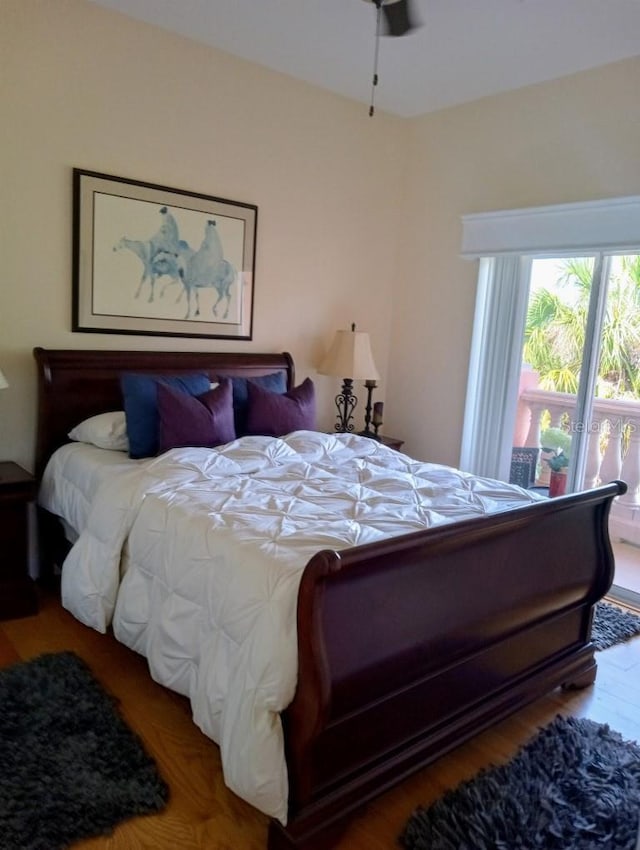 6926 Mccray Dr, Hudson, FL 34667 - bedroom with wood finished floors and access to exterior