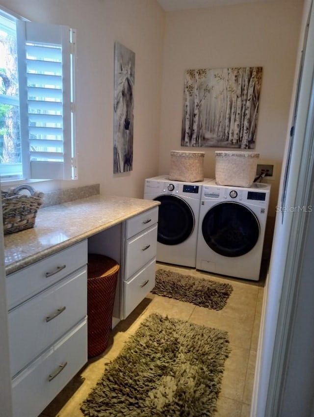 6926 Mccray Dr, Hudson, FL 34667 - laundry area with washer and clothes dryer and light tile patterned floors