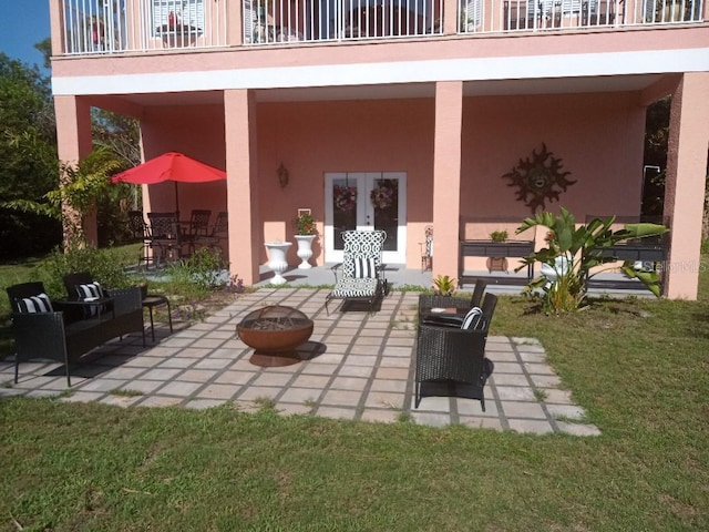 6926 Mccray Dr, Hudson, FL 34667 - view of patio with an outdoor fire pit and a balcony