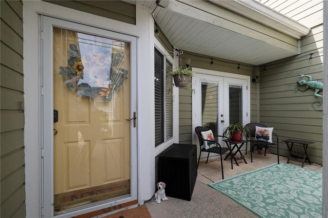 entrance to property featuring a patio area and french doors