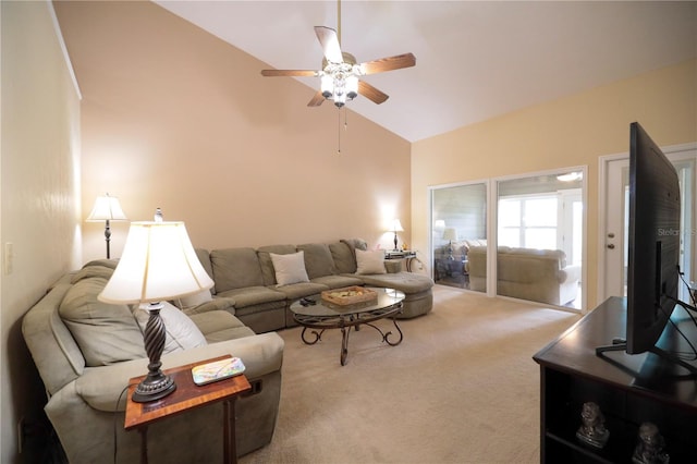 living area featuring lofted ceiling, a ceiling fan, and carpet floors