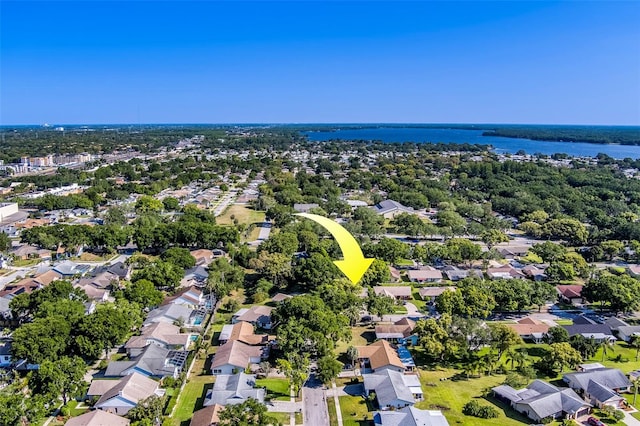 aerial view of residential area with a nearby body of water