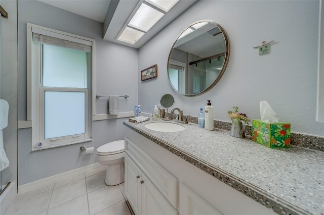 full bathroom featuring tile patterned flooring, toilet, a shower with door, vanity, and baseboards