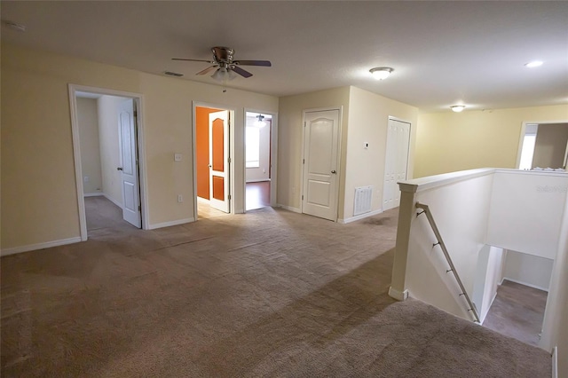 621 Washita Stone Dr, Ruskin, FL 33570 - empty room featuring a ceiling fan, carpet flooring, and visible vents