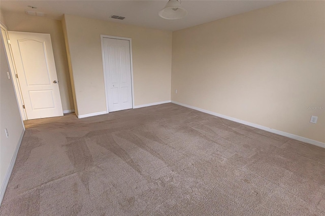 621 Washita Stone Dr, Ruskin, FL 33570 - carpeted spare room featuring baseboards and visible vents