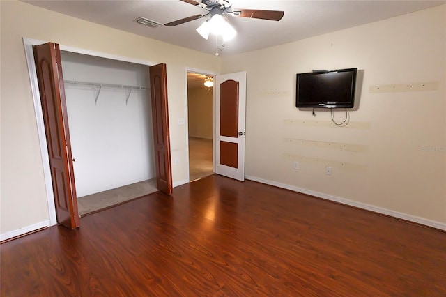 621 Washita Stone Dr, Ruskin, FL 33570 - unfurnished bedroom featuring a closet, wood finished floors, visible vents, a ceiling fan, and baseboards