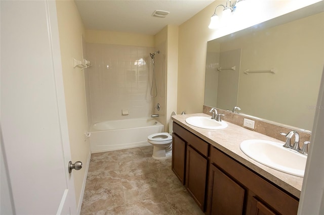 621 Washita Stone Dr, Ruskin, FL 33570 - bathroom featuring toilet, visible vents, a sink, and double vanity