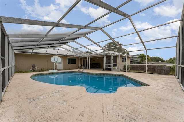 view of swimming pool featuring a patio area, a lanai, and a fenced in pool