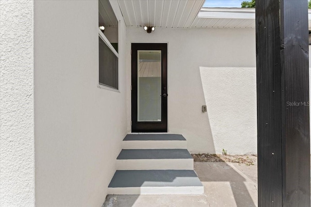 3215 E Powhatan Ave, Tampa, FL 33610 - doorway to property with stucco siding