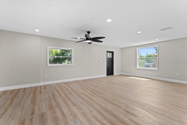 3215 E Powhatan Ave, Tampa, FL 33610 - empty room with light wood-style floors, recessed lighting, ceiling fan, and baseboards