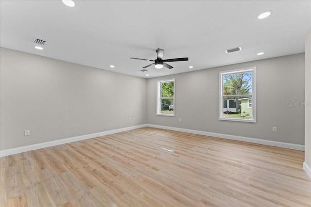 3215 E Powhatan Ave, Tampa, FL 33610 - unfurnished room with healthy amount of natural light, recessed lighting, a ceiling fan, light wood finished floors, and baseboards