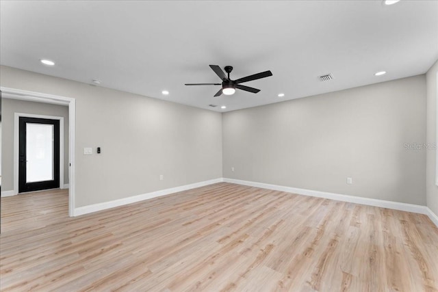 3215 E Powhatan Ave, Tampa, FL 33610 - unfurnished room featuring a ceiling fan, recessed lighting, light wood-style floors, and baseboards