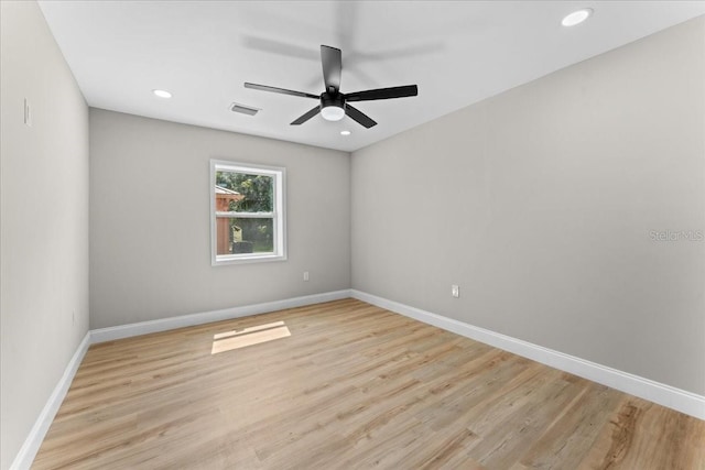 3215 E Powhatan Ave, Tampa, FL 33610 - unfurnished room featuring ceiling fan, baseboards, light wood-type flooring, and recessed lighting