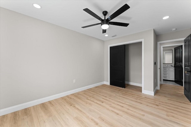 3215 E Powhatan Ave, Tampa, FL 33610 - unfurnished bedroom with baseboards, light wood-style floors, recessed lighting, ceiling fan, and a closet