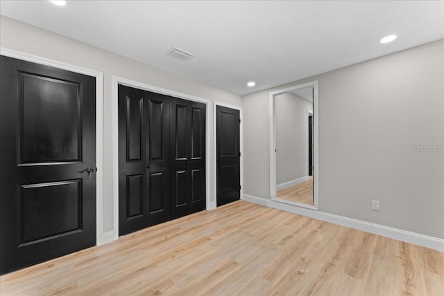 3215 E Powhatan Ave, Tampa, FL 33610 - unfurnished bedroom featuring wood finished floors, baseboards, and recessed lighting