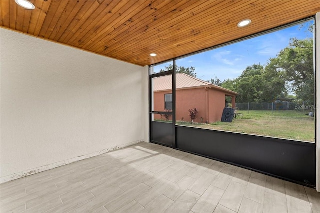 3215 E Powhatan Ave, Tampa, FL 33610 - unfurnished sunroom with plenty of natural light