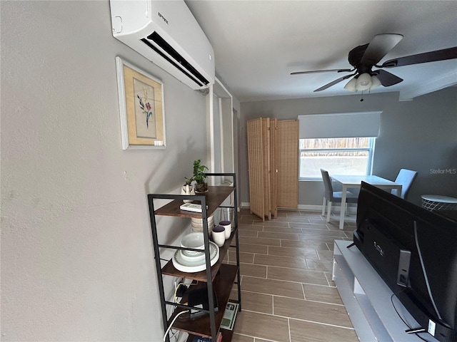 hallway featuring baseboards and a wall unit AC