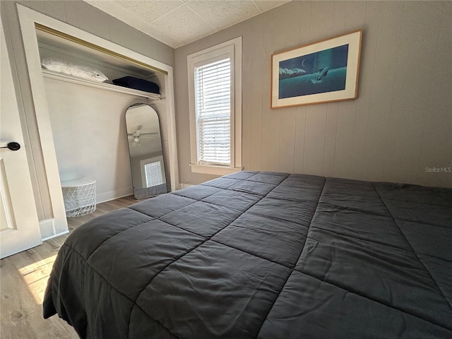 bedroom featuring wood finished floors