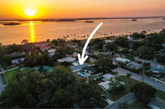aerial view of residential area featuring a nearby body of water