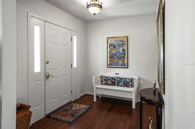 foyer featuring wood finished floors and baseboards