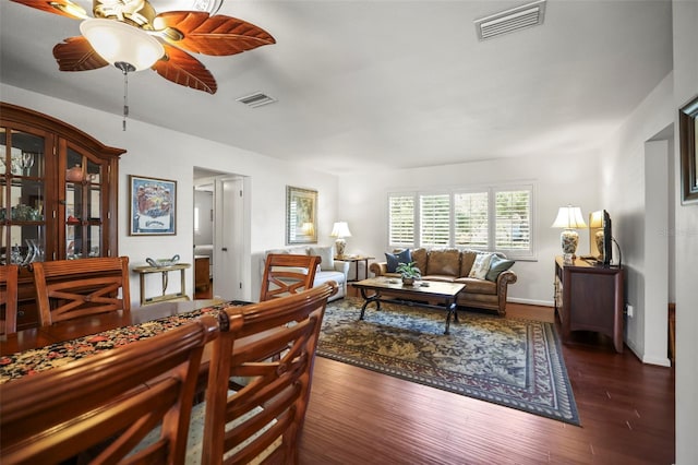 living room featuring a ceiling fan and wood finished floors