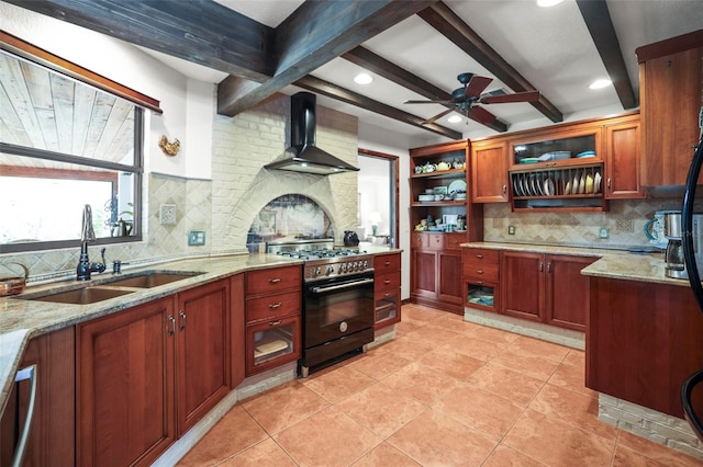 kitchen featuring stainless steel appliances, wall chimney exhaust hood, a sink, open shelves, and backsplash